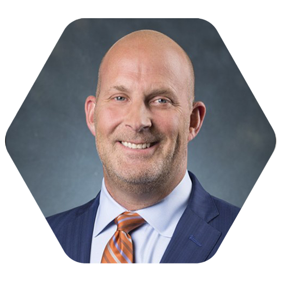 headshot in a hexagon cutout of Mike Ramseier